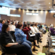 Nuka Conference attendees listening to a presentation