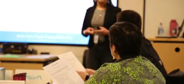 participants in ASTP listening to a presentations