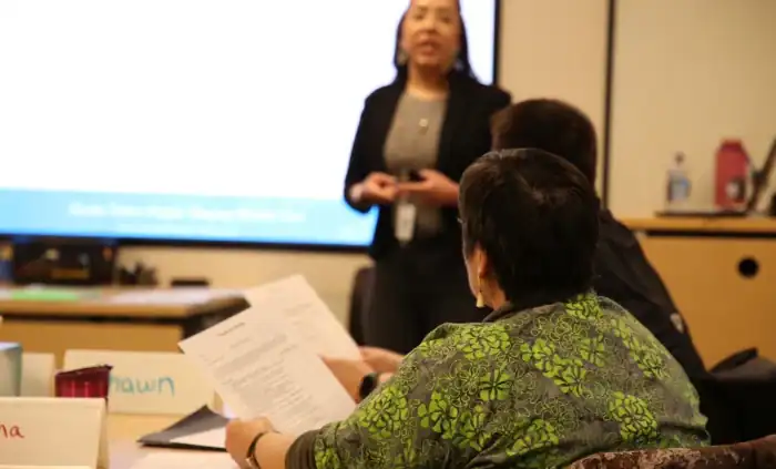 participants in ASTP listening to a presentations