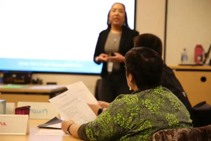 participants in ASTP listening to a presentations