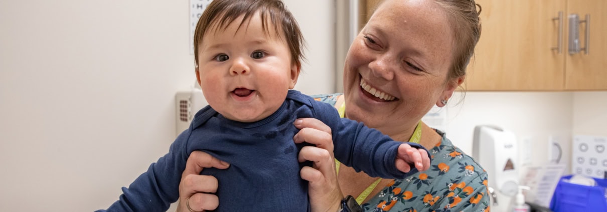 Mom and baby smiling