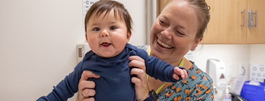Mom and baby smiling