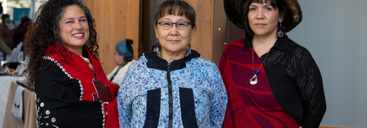Three women in traditional Alaska Native clothing
