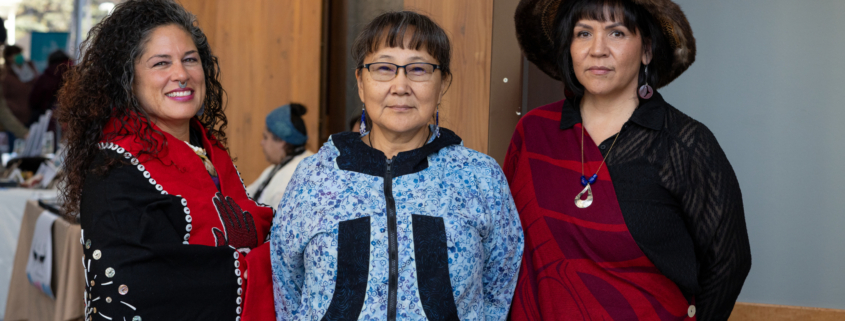 Three women in traditional Alaska Native clothing