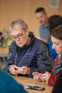 Conference attendees beading
