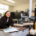 Two people having a conversation in an office setting