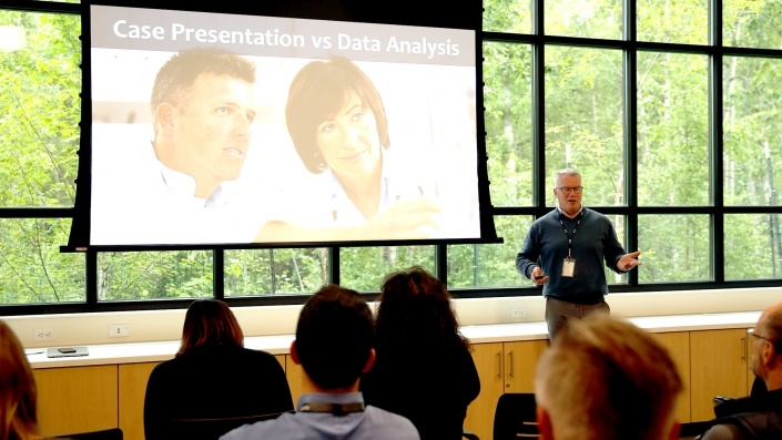 Steve Tierney giving a presentation on Case Presentation vs Data Analysis