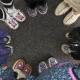 People wearing moccasins standing in a circle